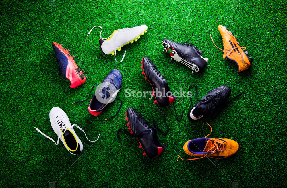 Various Colorful Cleats Against Artificial Turf Studio Shot On