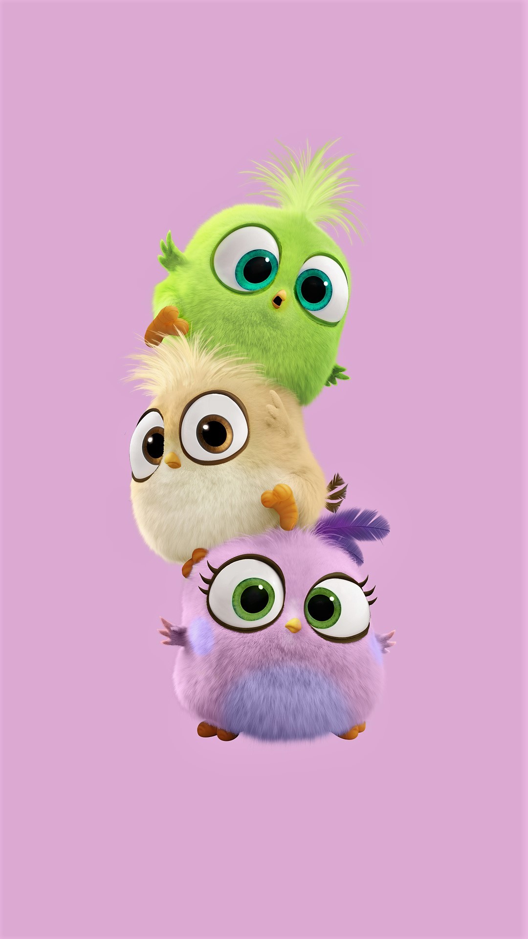 Three adorable, fluffy, round cartoon birds stacked on top of each other against a pastel purple background. The top bird is bright green, the middle bird is light yellow, and the bottom bird is lavender