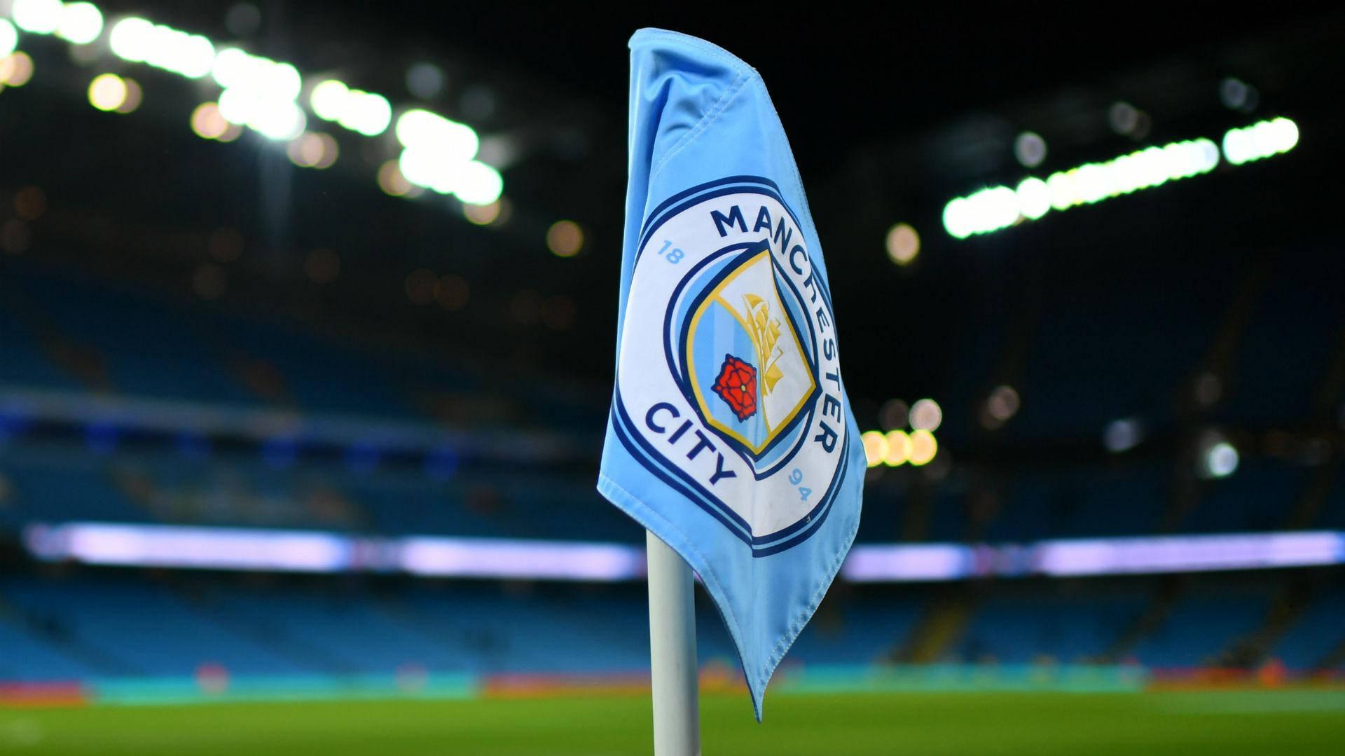 Download Manchester City 4k Flag On Pole Wallpaper