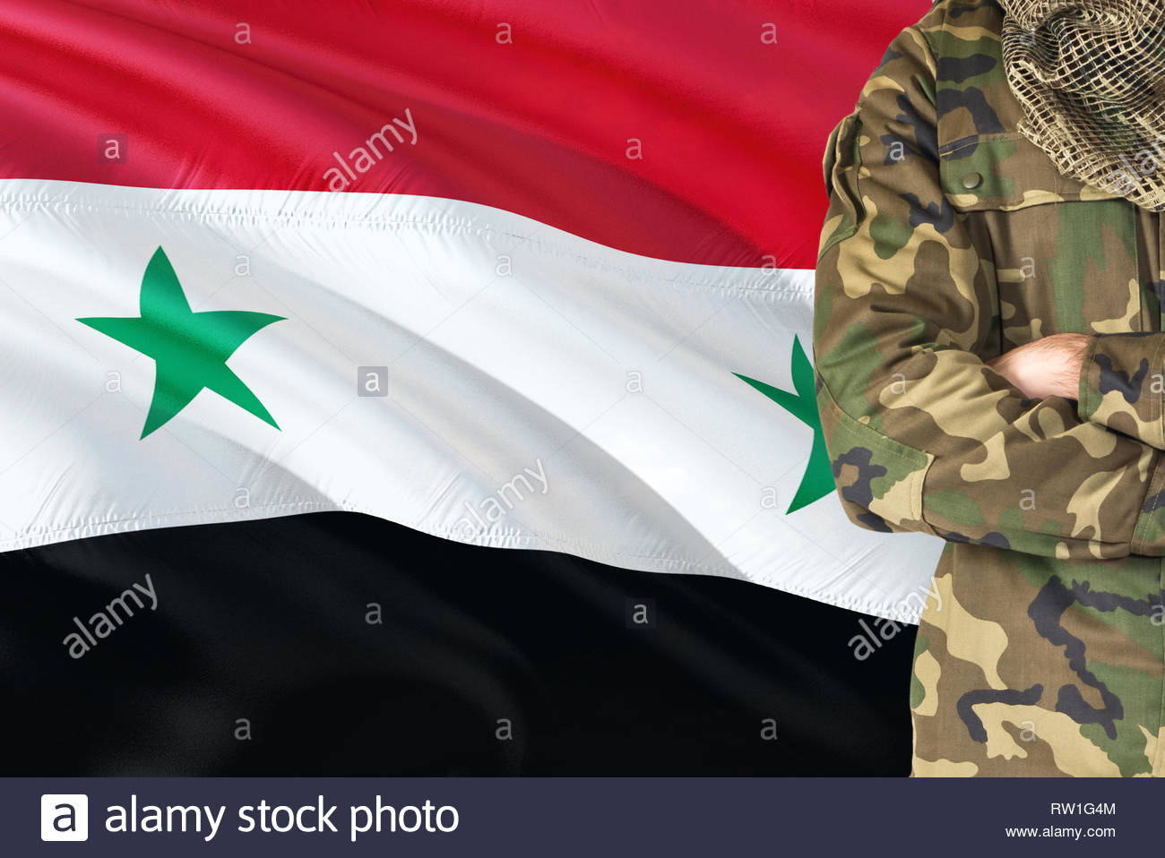 Crossed Arms Syrian Soldier With National Waving Flag On
