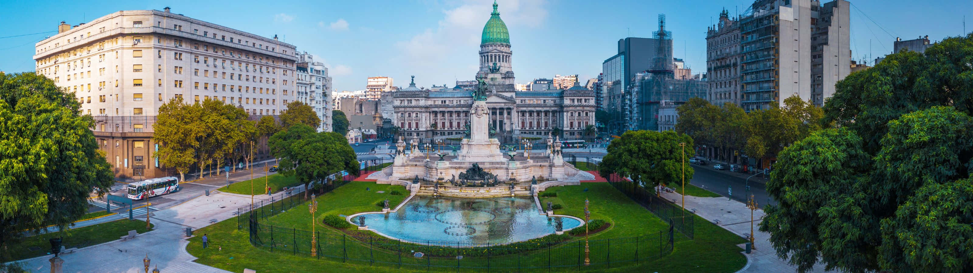 Panoramic view of the Palace of the National Congress of Argentina in Buenos Aires, featuring the surrounding park and cityscape