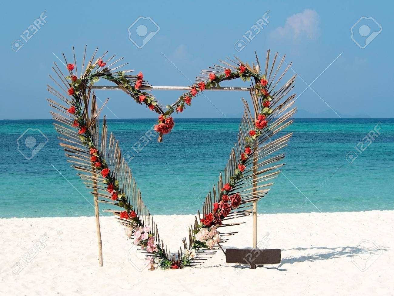 Heart From Red Flowers Palm Leafs On Summer Ocean Beach Background