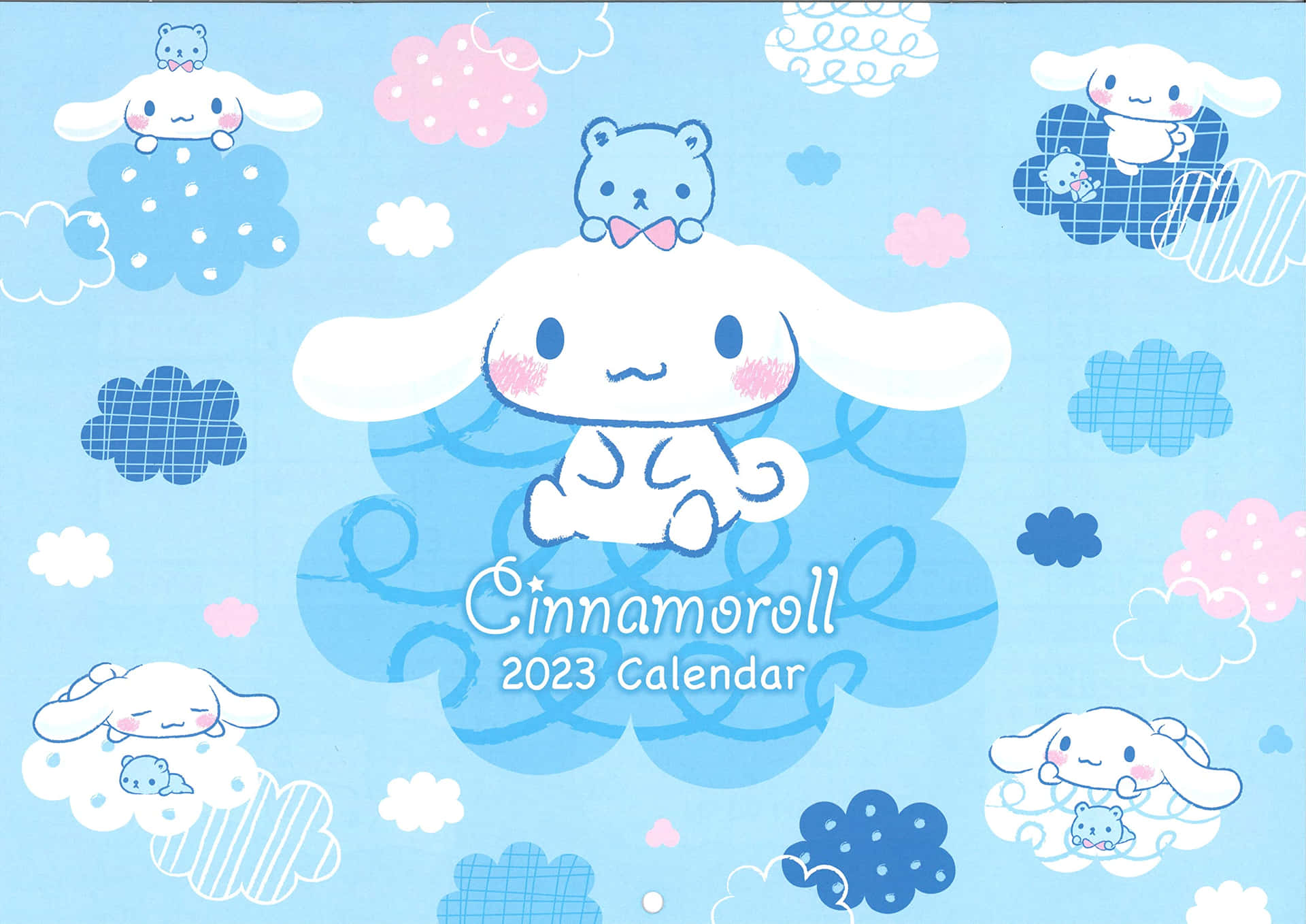 A light blue Cinnamoroll 2023 calendar cover featuring the adorable Sanrio puppy amidst fluffy clouds and with a cute blue bear companion
