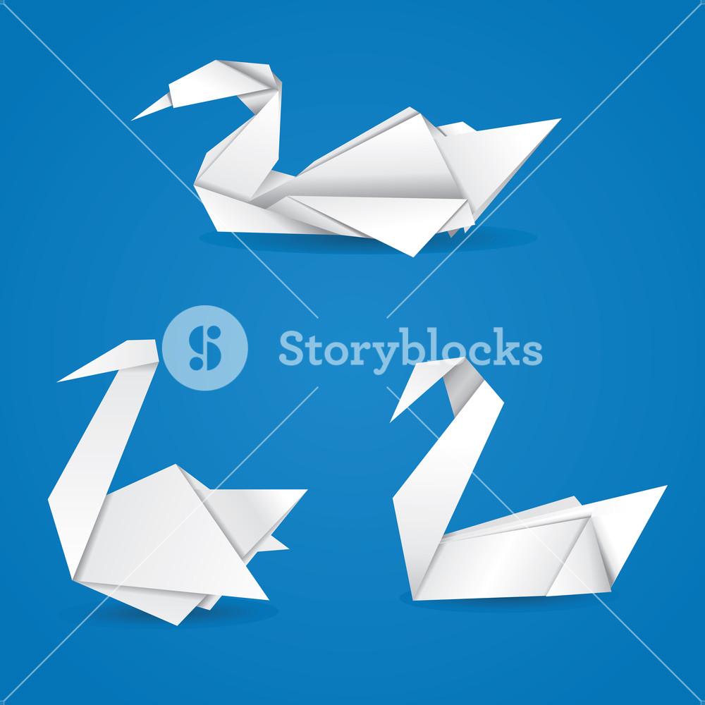 White Folded Paper Swans On Blue Background Royalty Stock