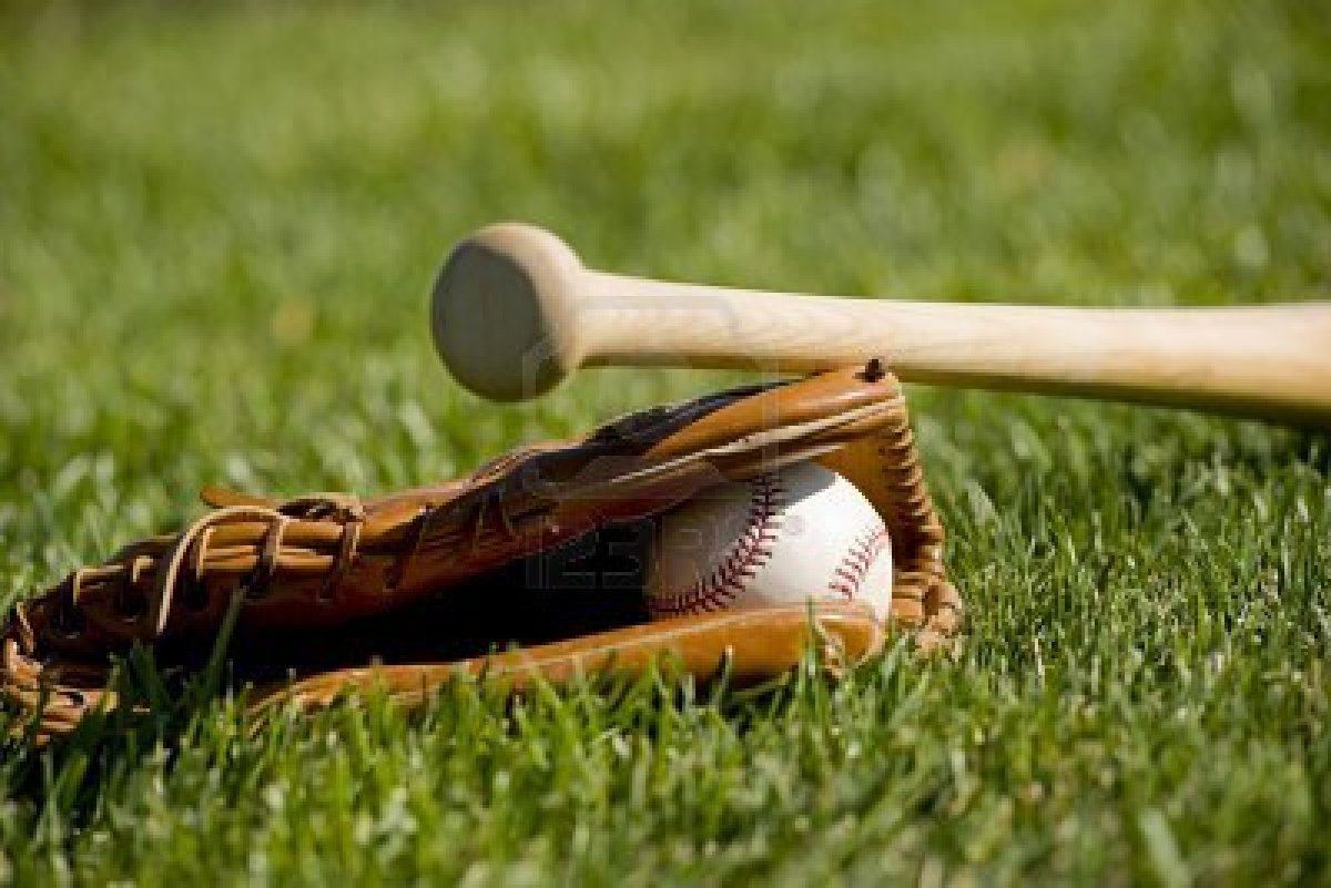 Baseball Field With A Leather Glove Ball And Wooden Bat