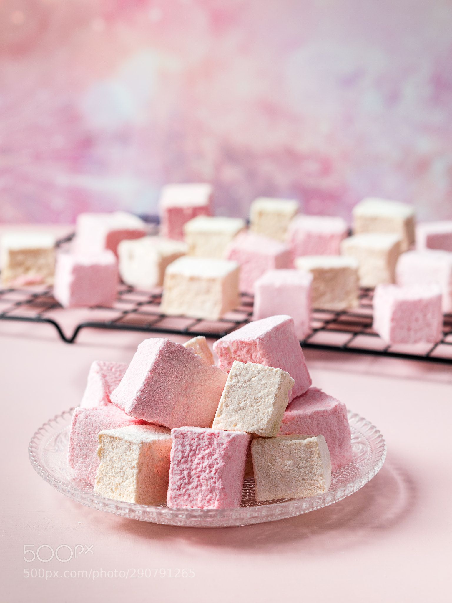 Colorful Marshmallows In A Glass Plate On Pink Bokeh Background