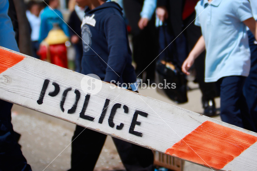 Police Barricade With Children In The Background Focus On