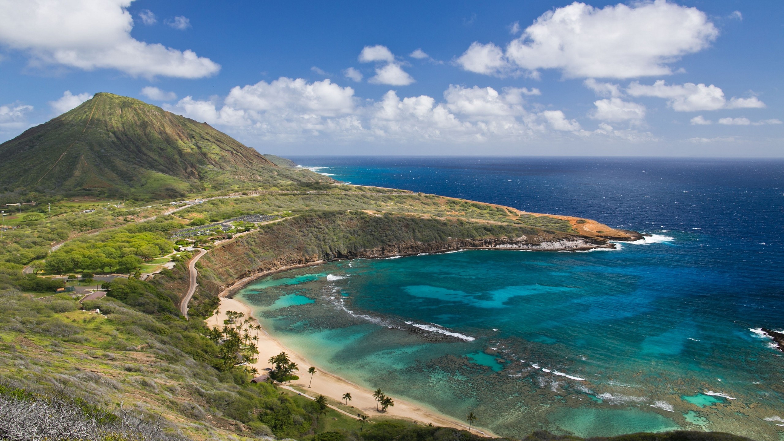 Scenic view of Hanauma Bay, Oahu, Hawaii, with turquoise water, sandy beach, and Koko Crater in the background