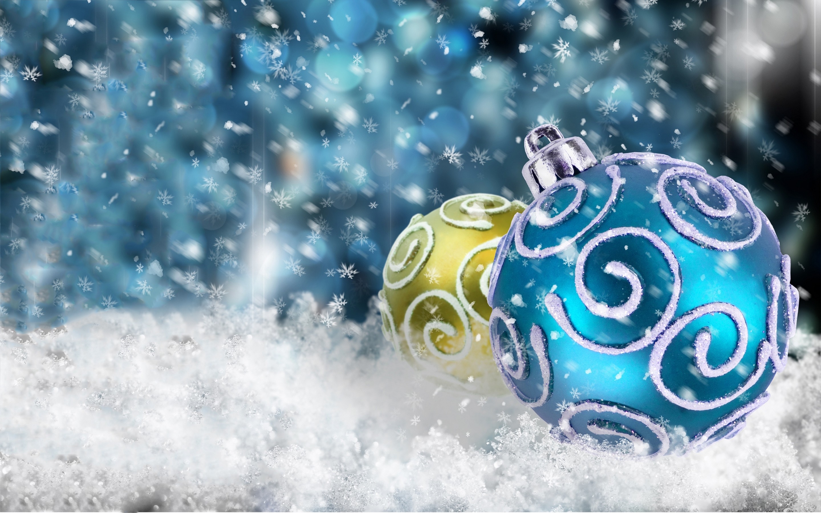 Christmas ornaments nestled in snow against a festive blue background with falling snowflakes