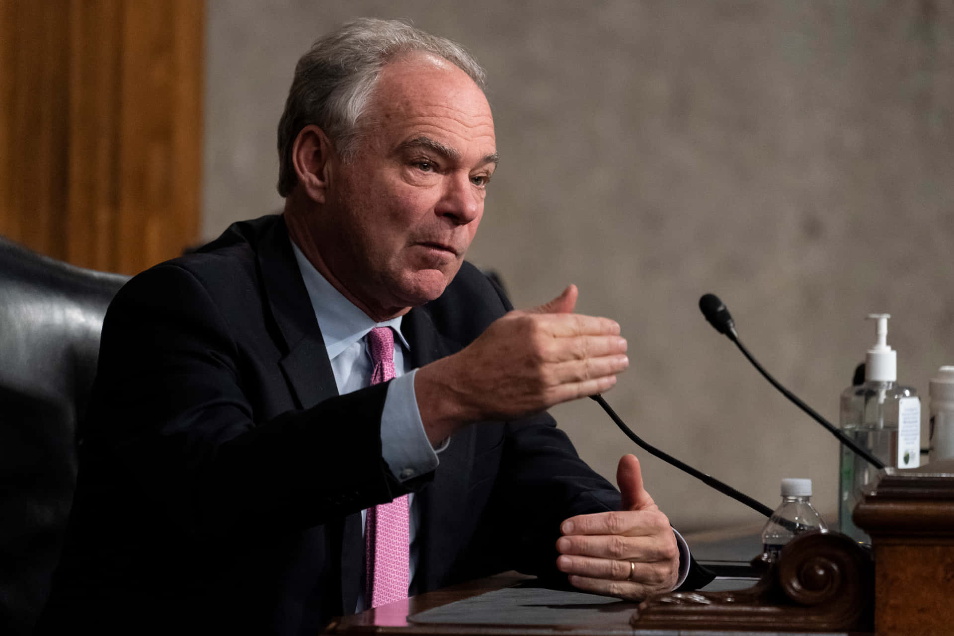 Tim Kaine Gesturing With Both Hands Wallpaper