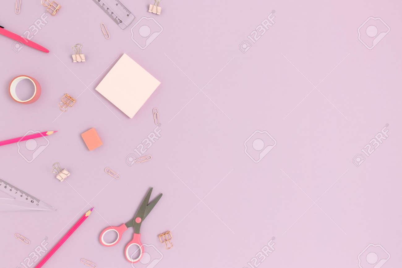 Top Of Various Stationery On A Purple Pastel Background Back