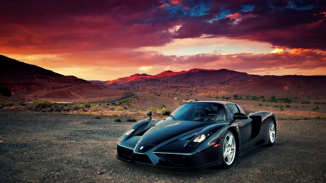 Black Enzo Ferrari In Mountains Sunset