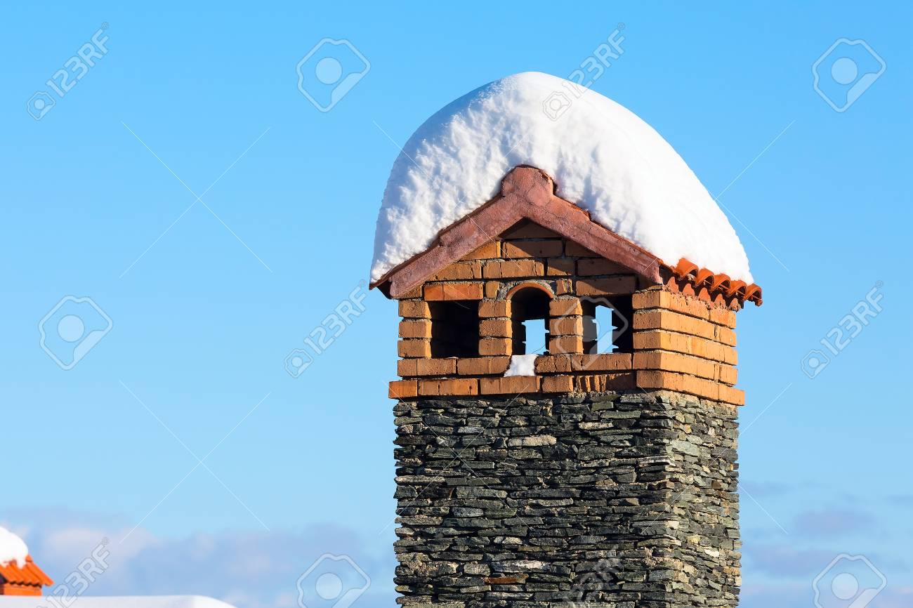 Snowy Winter Background Chimney And Chalet Roof Covered With