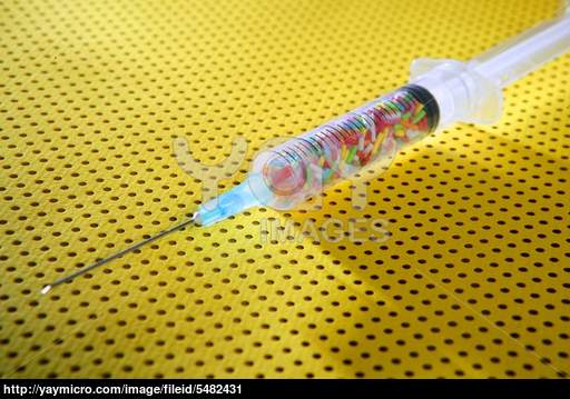 Little Colorful Candy Syringe Over Yellow Background Health Metaphor