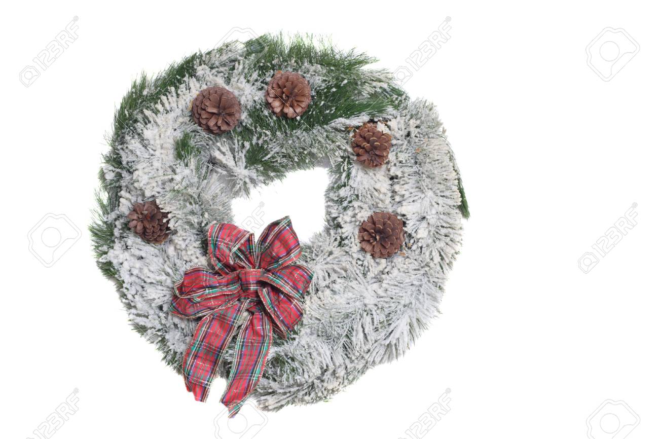 Flocked Christmas Wreath With Red Bow On A White Background Stock