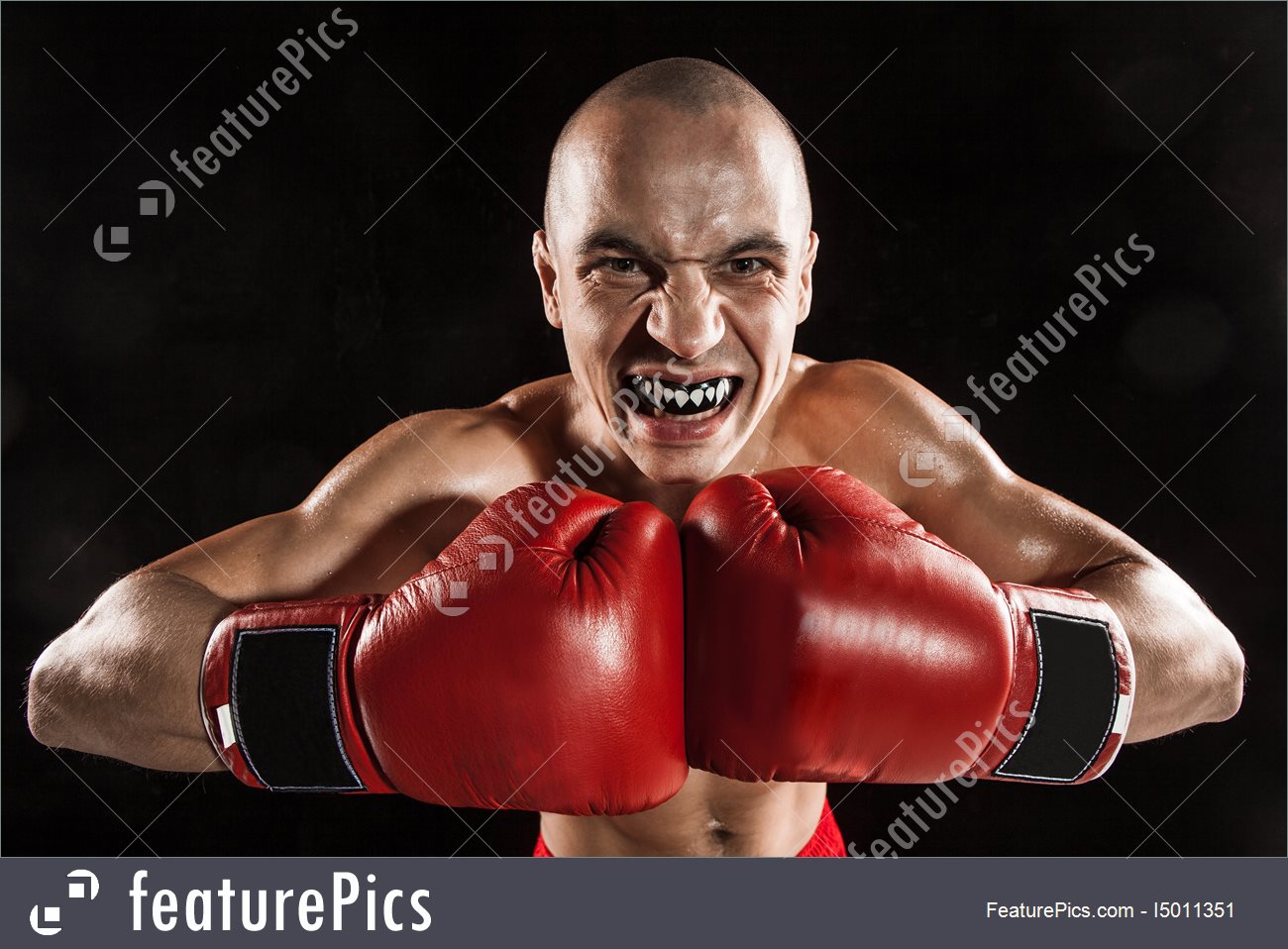 Young Man Kickboxing On Black With Kapa In Mouth Stock Image