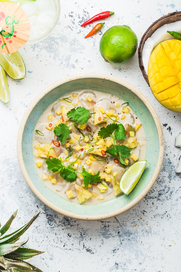 Raw Scallops Appetizer With Tropical Fruits Whaite Background