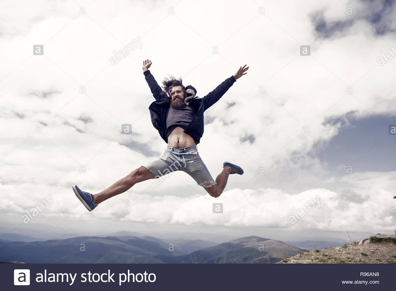 Jump Dom Guy Or Bearded Man On Cloudy Sky Background