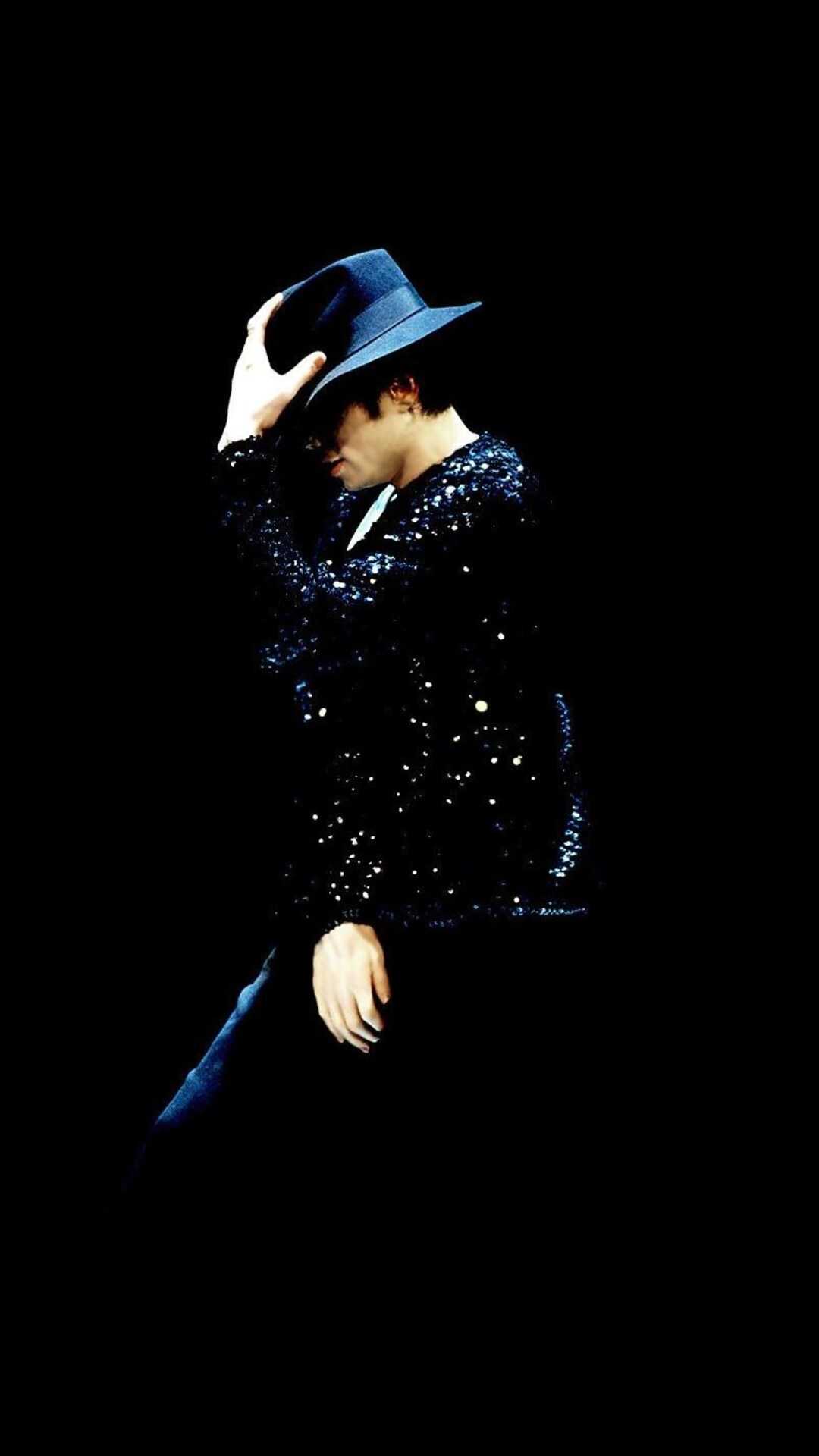 Michael Jackson in a fedora and sequined jacket