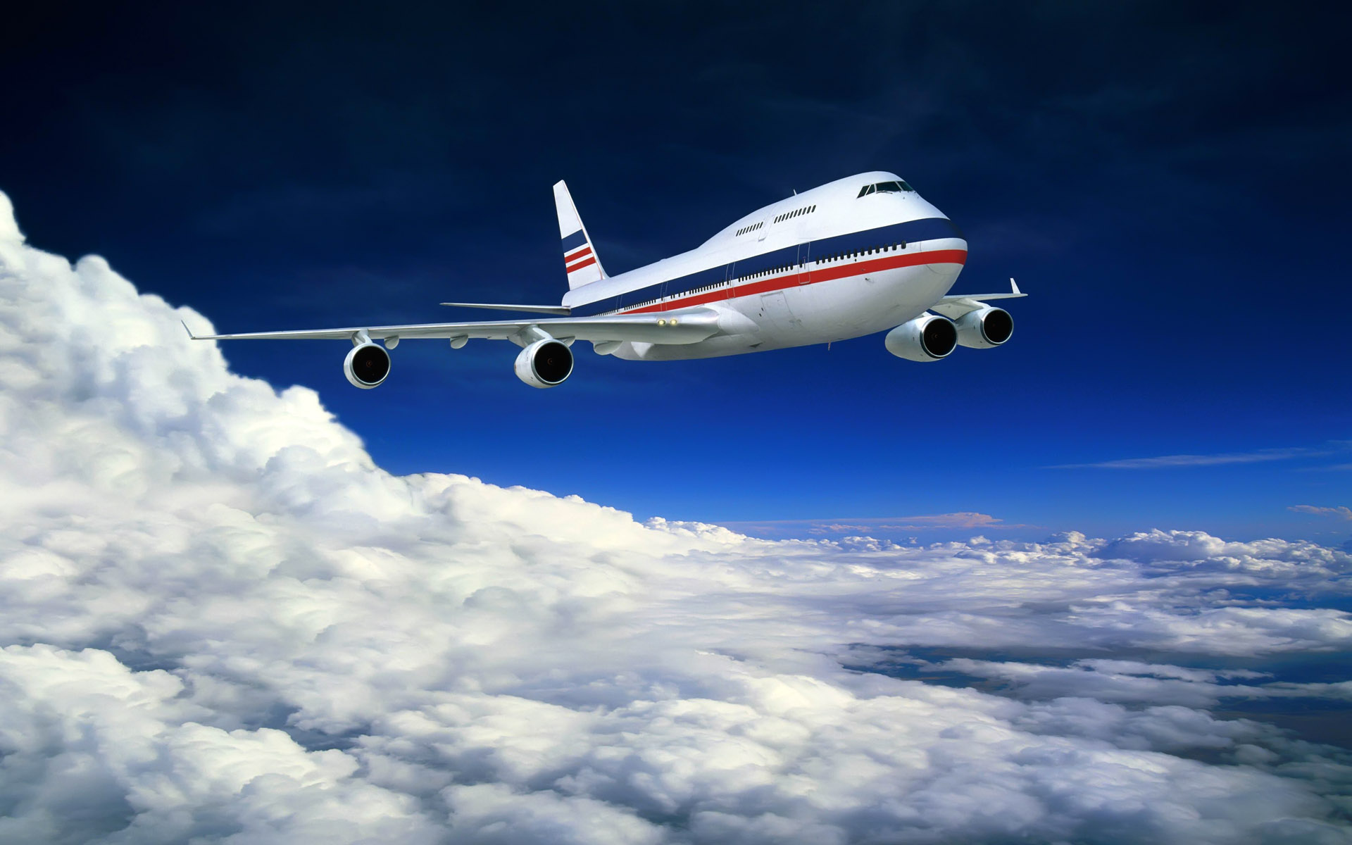 A majestic jumbo jet soars through a vibrant blue sky, gracefully navigating a sea of fluffy white clouds. Perfect for aviation enthusiasts and dreamers alike