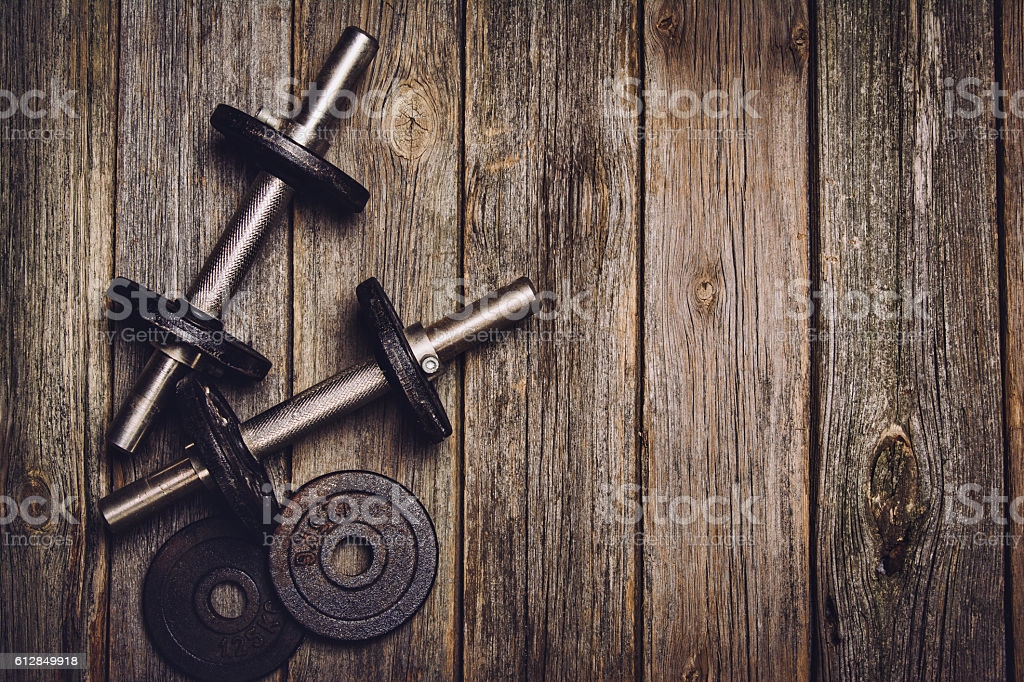 Fitness Workout Background Dumbbells On Wooden Floor Stock Photo