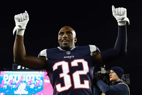 Devin Mccourty Of The New England Patriots In Action Wallpaper