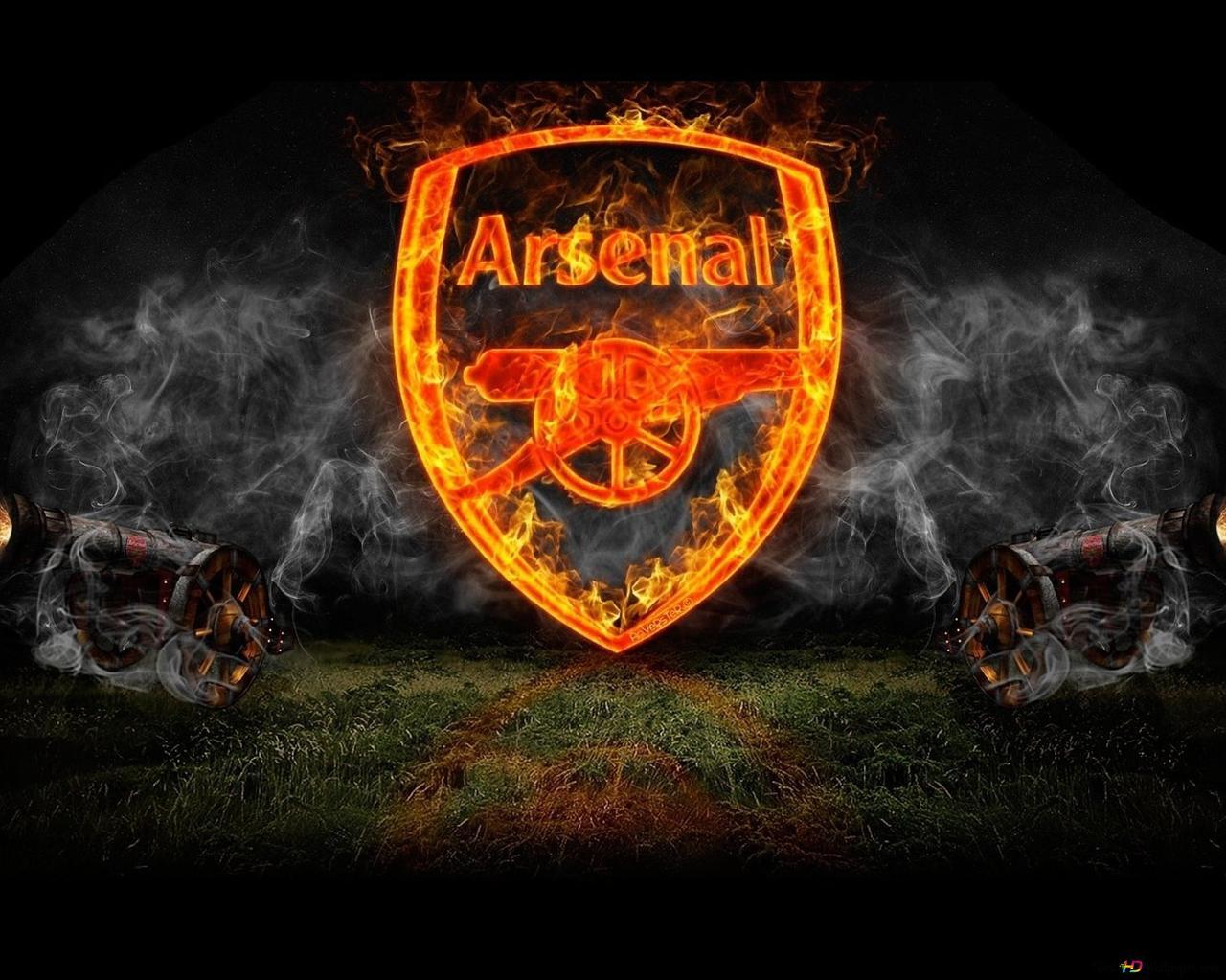 Arsenal Football Club Logo Dark On The Stadium Grass Among
