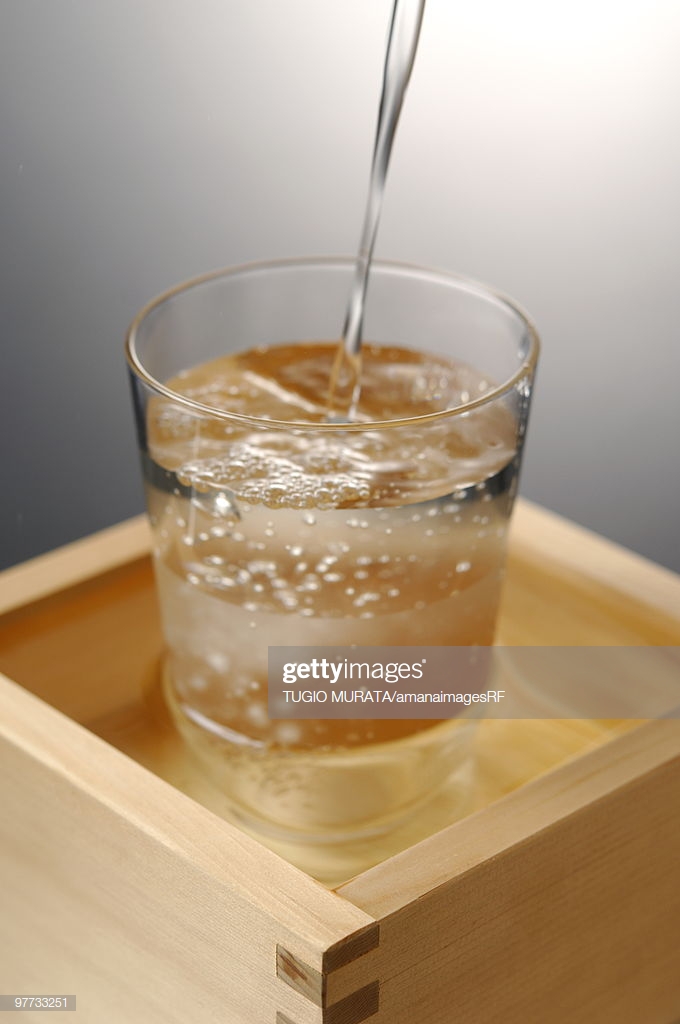 Sake Pouring Into Glass Colored Background Stock Photo Getty Image