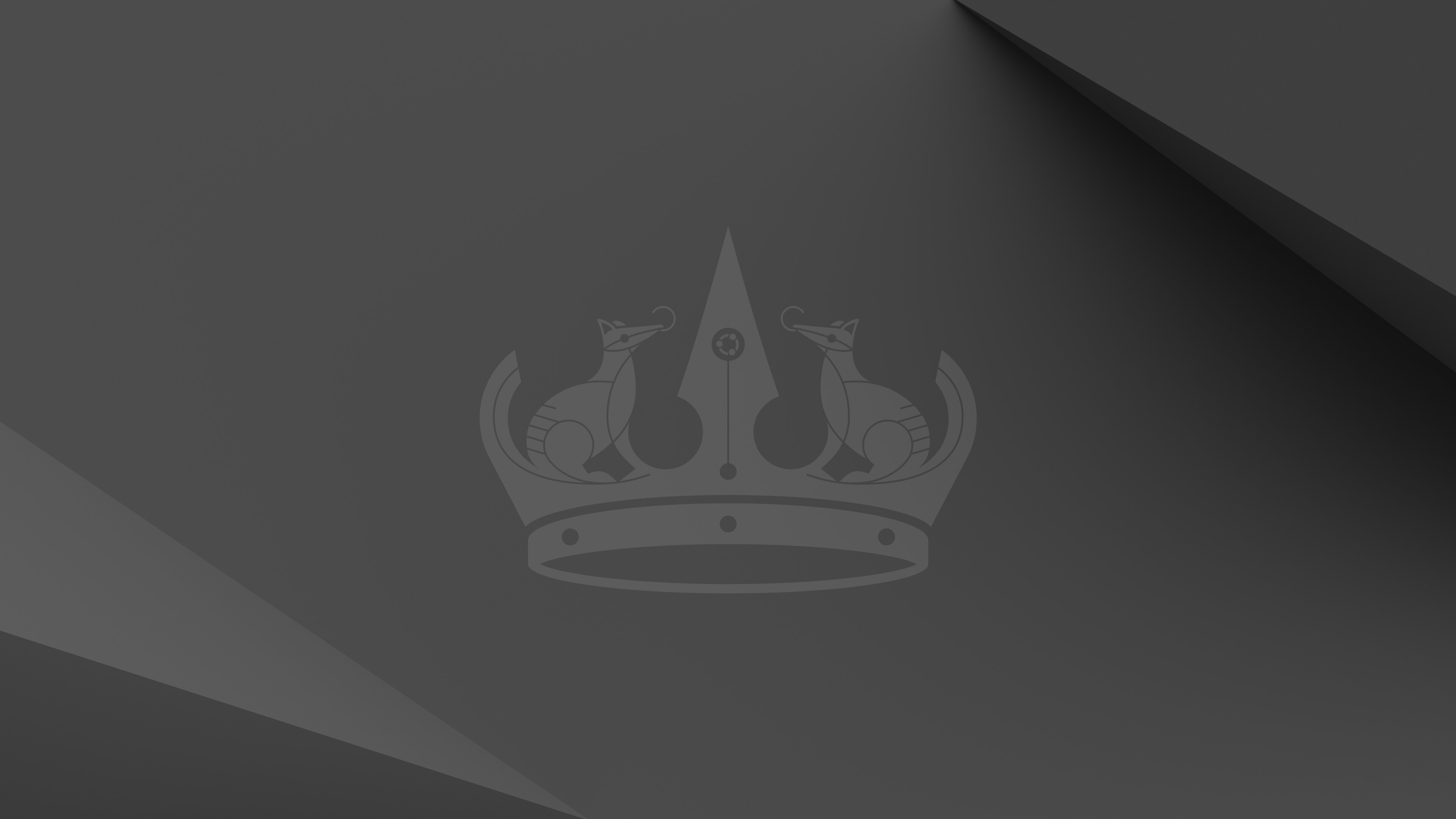 A stylized numbat logo, featuring two numbats facing each other, atop a crown. Set against a dark gray background with geometric shapes