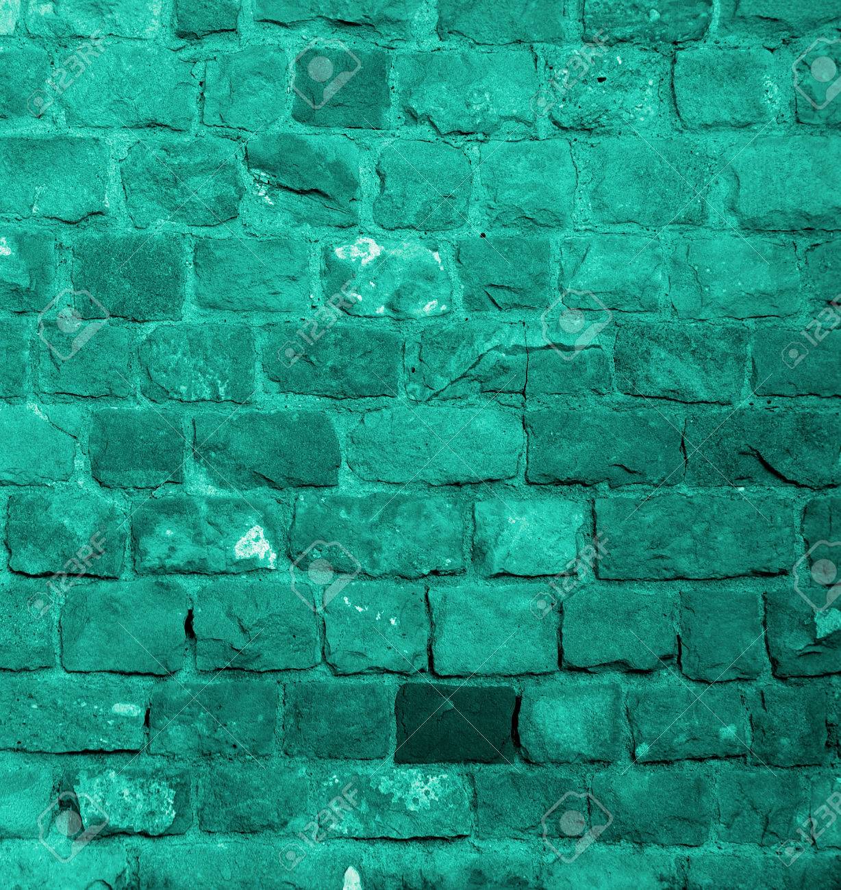Background Of Turquoise Old Damaged Bricks With Concrete Smoothing