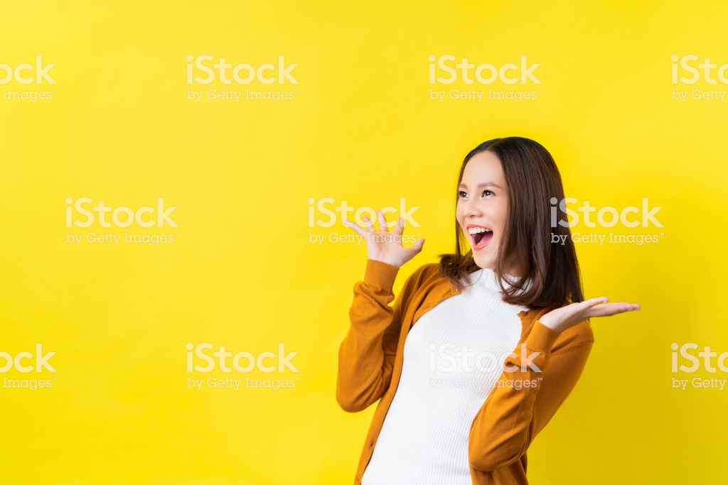 Asian Girl Is Surprised She Excitedyellow Background Studio