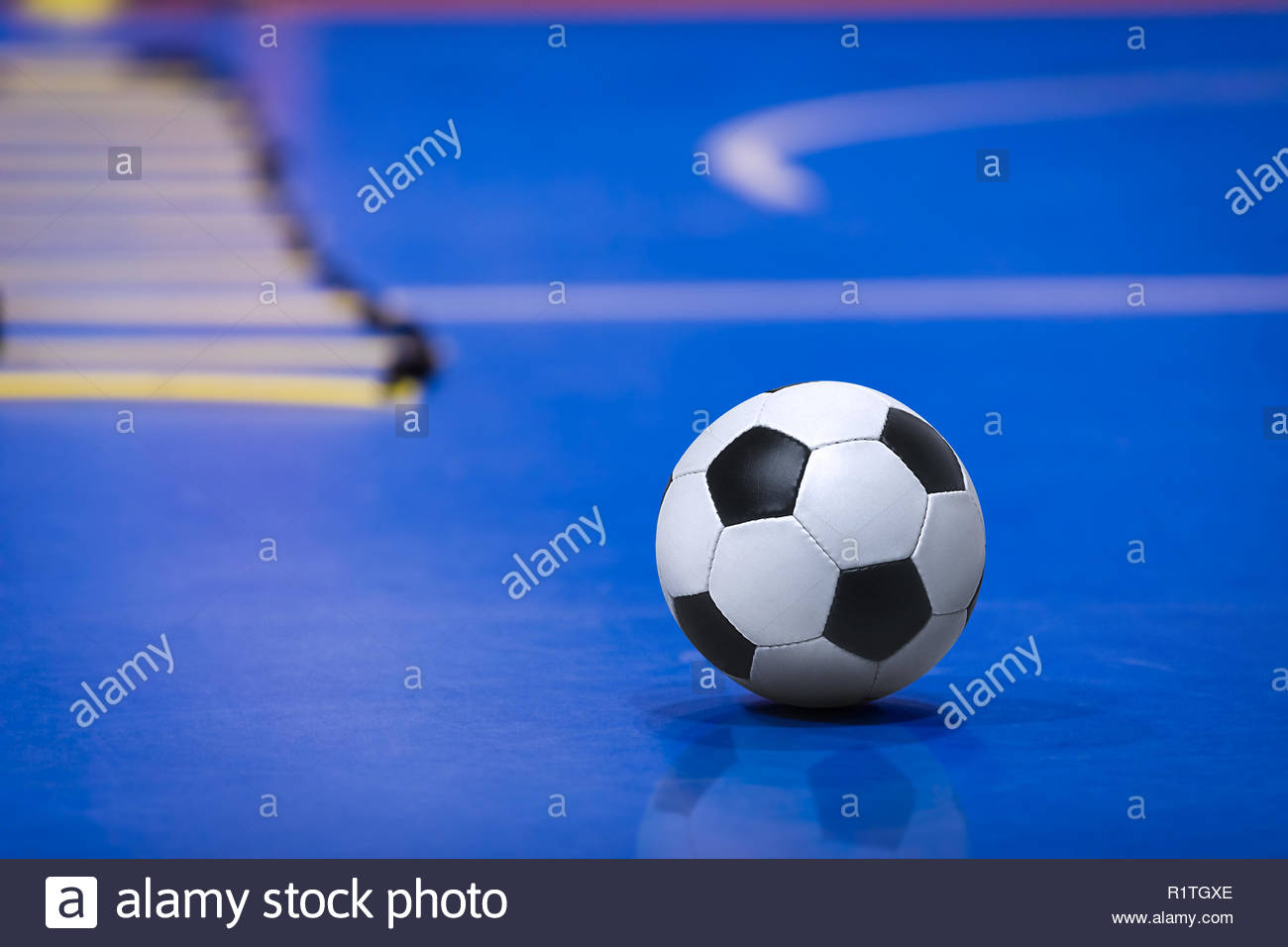 Soccer Football Ball On Futsal Field Blue Training Pitch