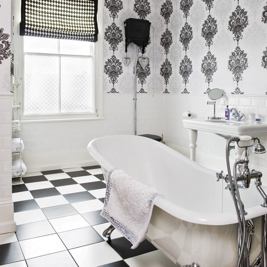 Monochrome Bathroom With Tiled Floors Standing Bath Sink And