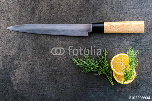 Fillet Fish Knife With Lemon On Grey Background Kitchen Accessories