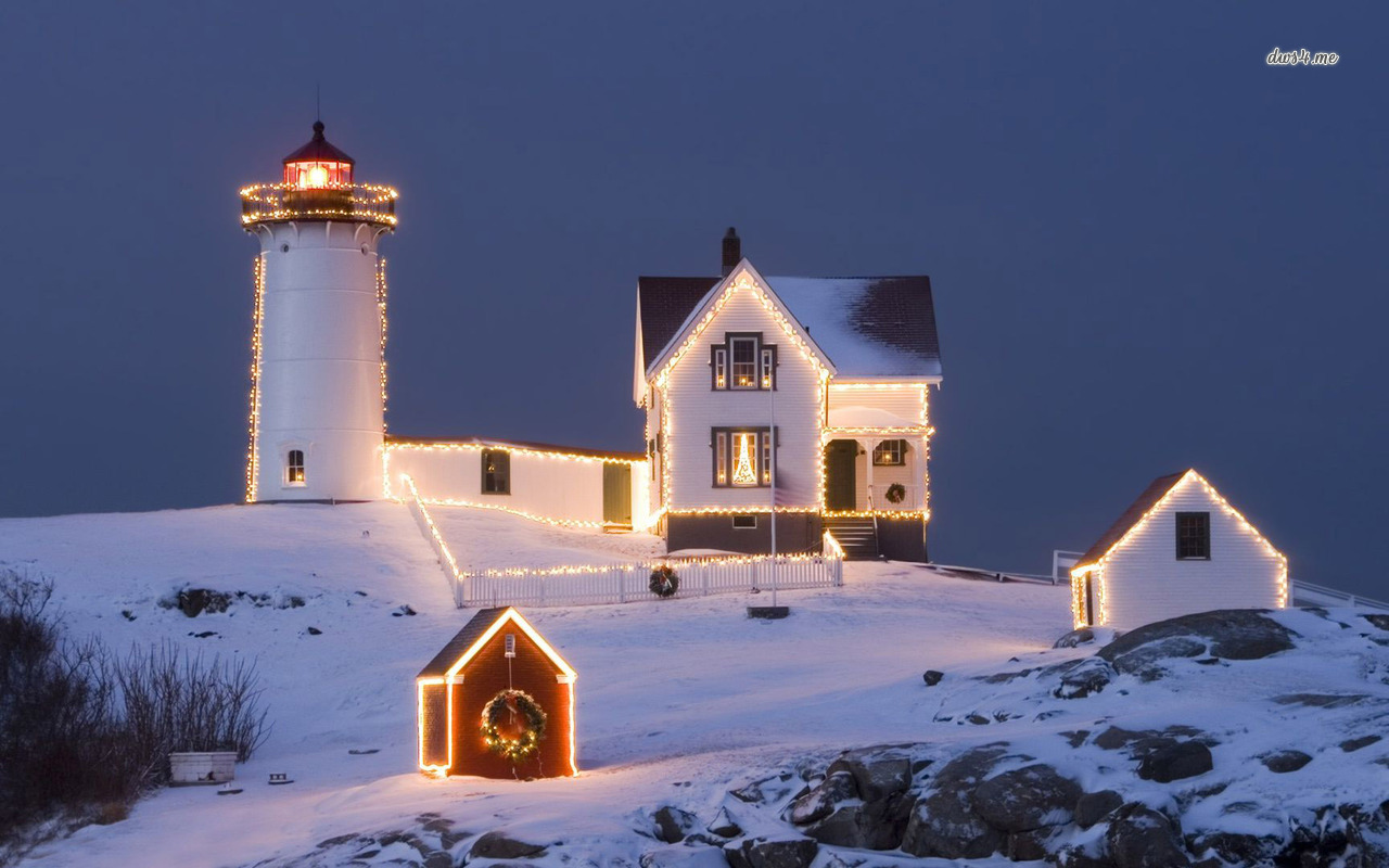 Christmas Lights Sourrounding The Lighthouse Wallpaper