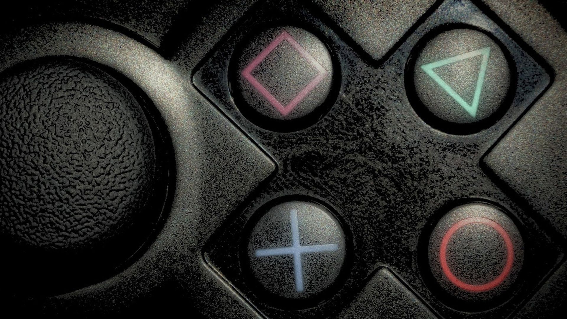 Close-up of PlayStation controller buttons: square, triangle, circle, and cross/directional pad