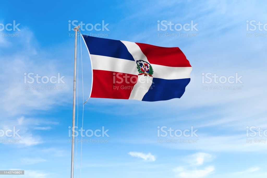 Free download Dominican Republic Flag Over Blue Sky Background Stock
