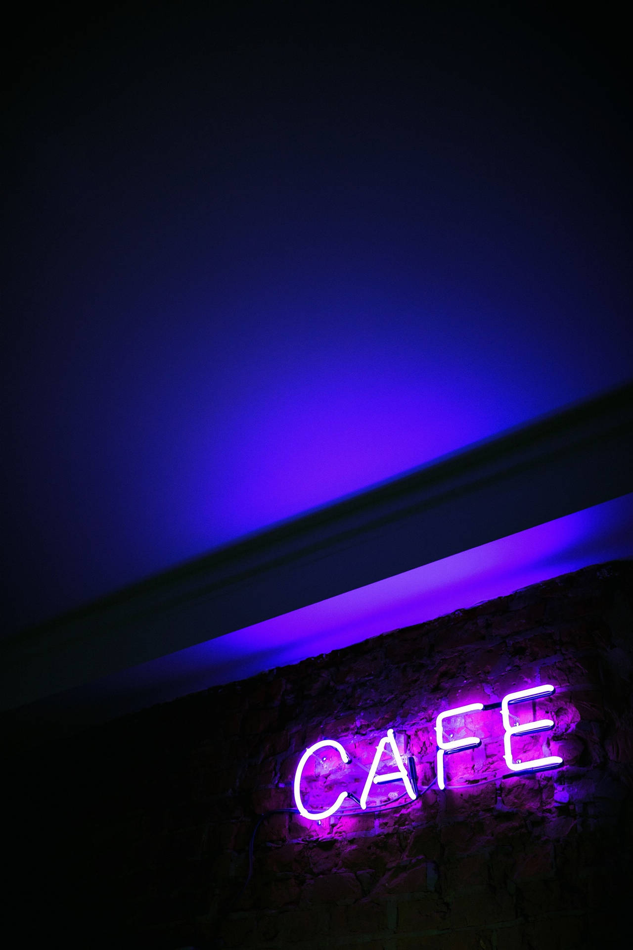 A Neon Purple Landscape Tinged By The Glow Of Horizon Wallpaper