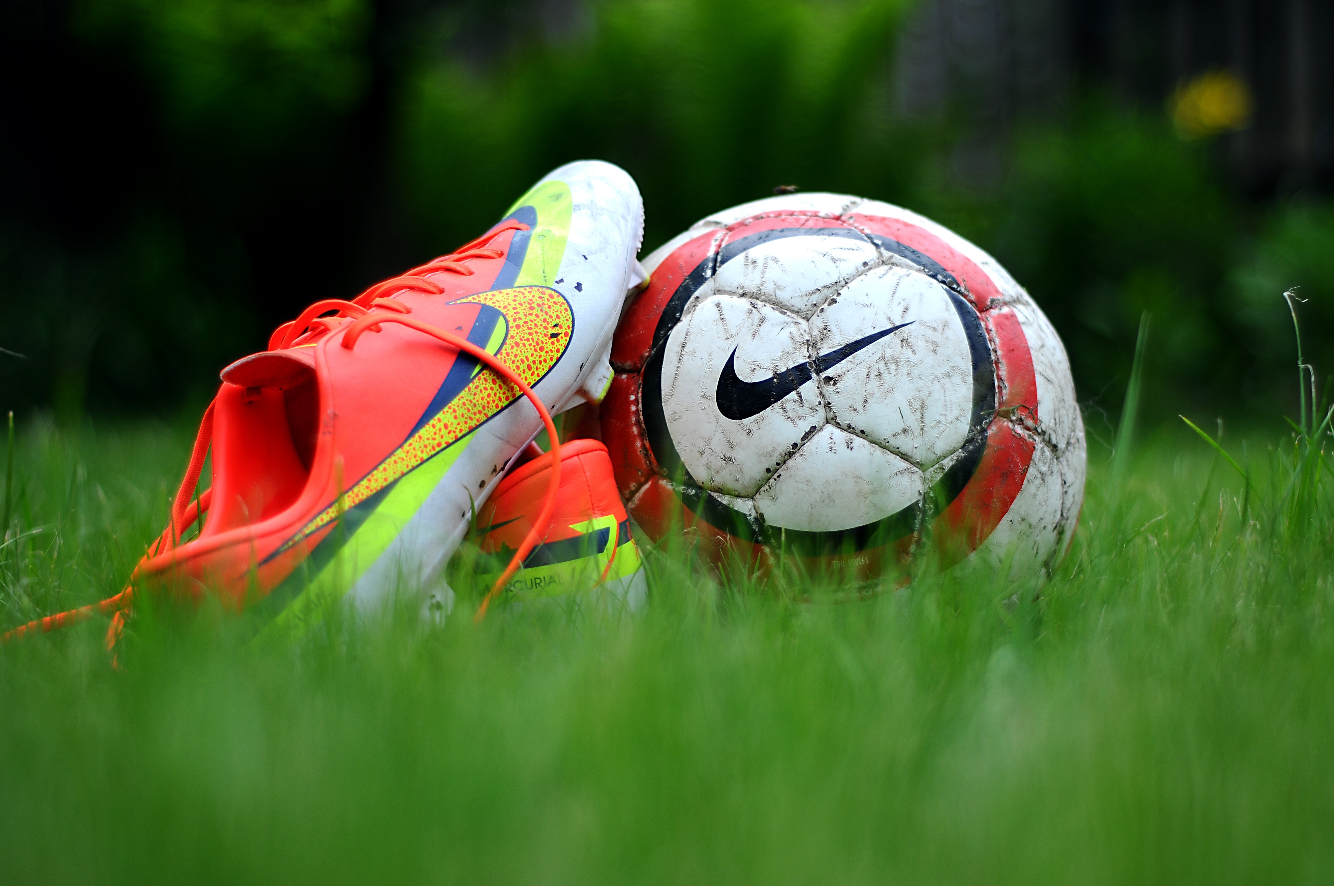 Close Up Photography Of Nike Soccer Cleats And Ball On