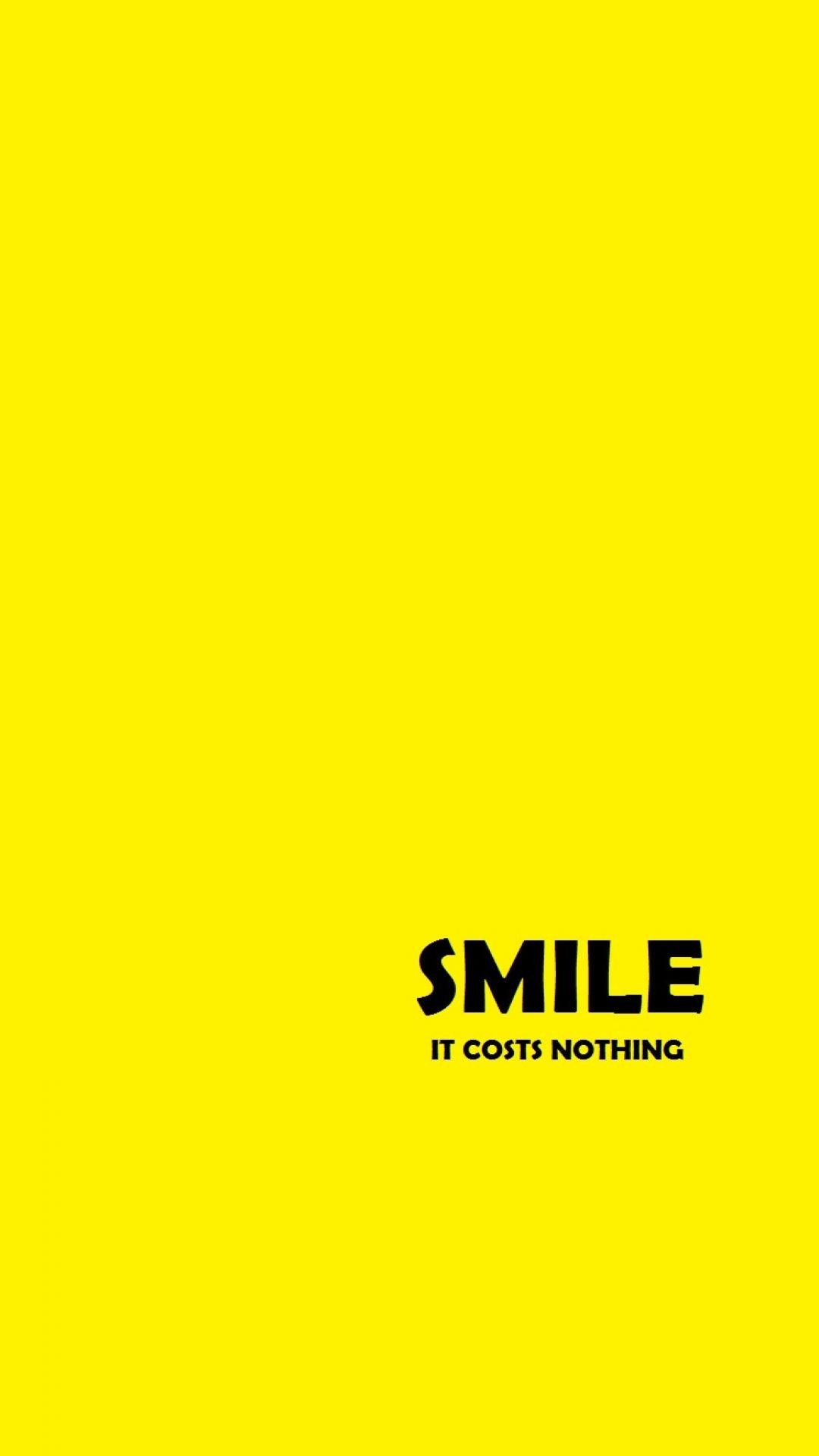 Bright yellow wallpaper with the inspirational quote 'Smile. It costs nothing.'