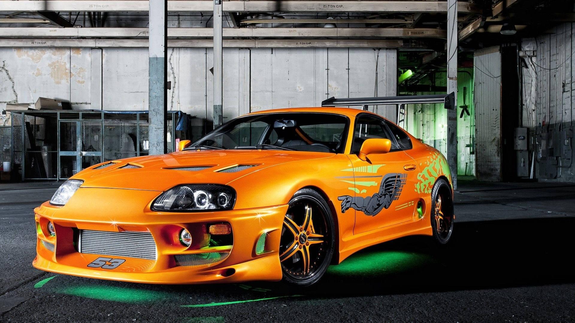 Download Iconic Metallic Orange Toyota Supra Wallpaper