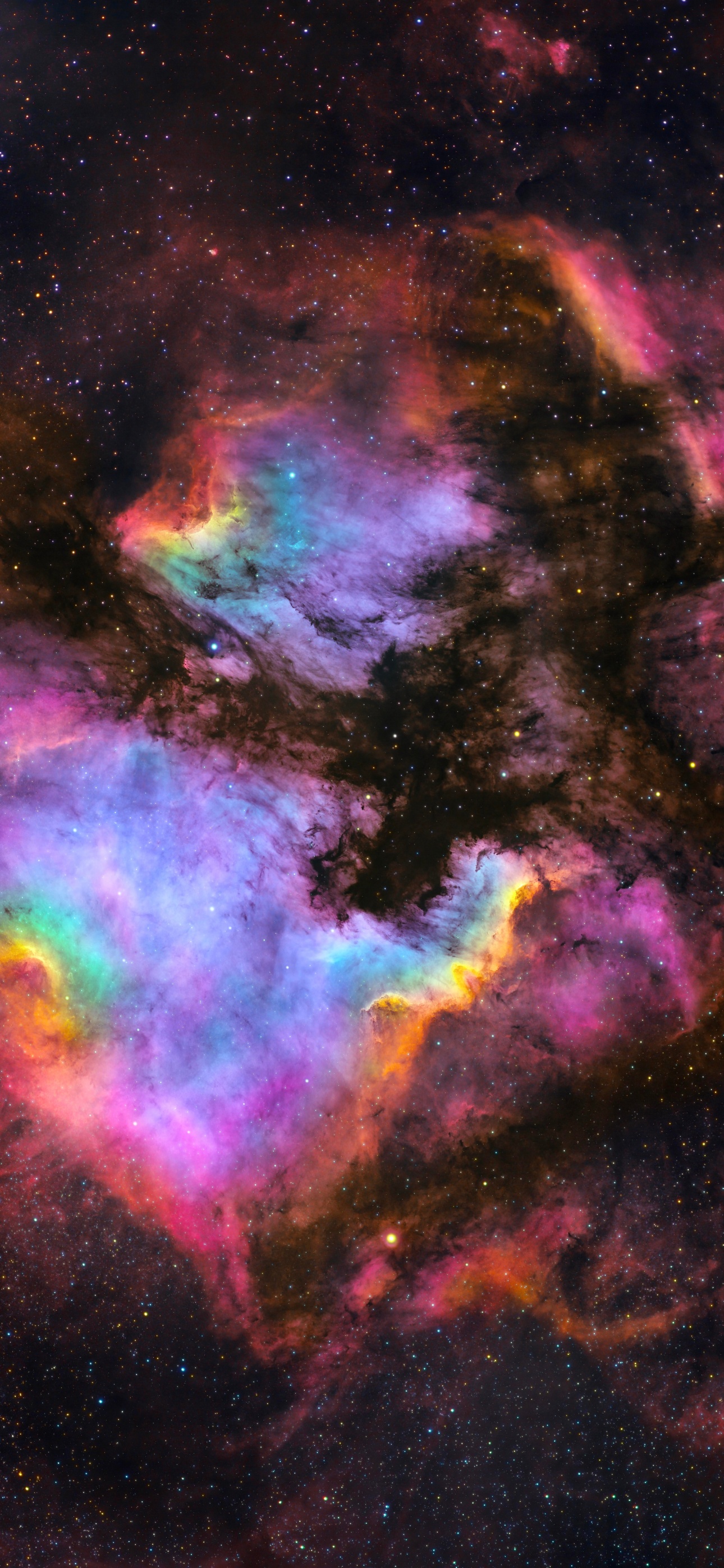 A stunning image of a vibrant nebula, showcasing a cosmic array of colors and starry backdrop, ideal for an iPhone wallpaper