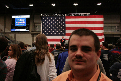 Me And Bill Clinton In Background Speaking Photo Sharing
