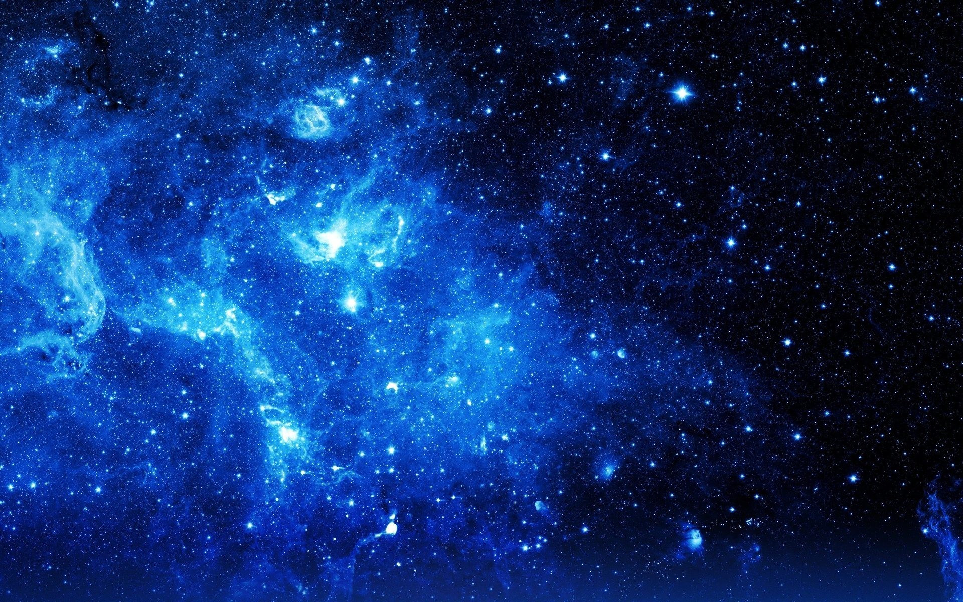 A breathtaking view of a blue nebula, sparkling with countless stars, perfect for a universe-themed iPhone wallpaper