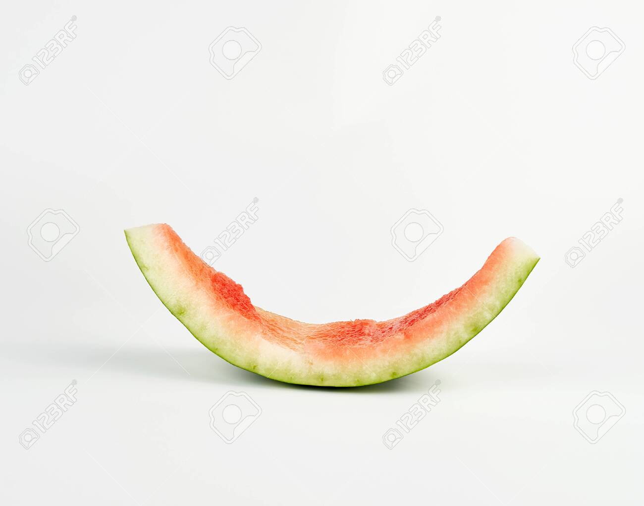 Stub Of Red Ripe Round Watermelon On A White Background Close