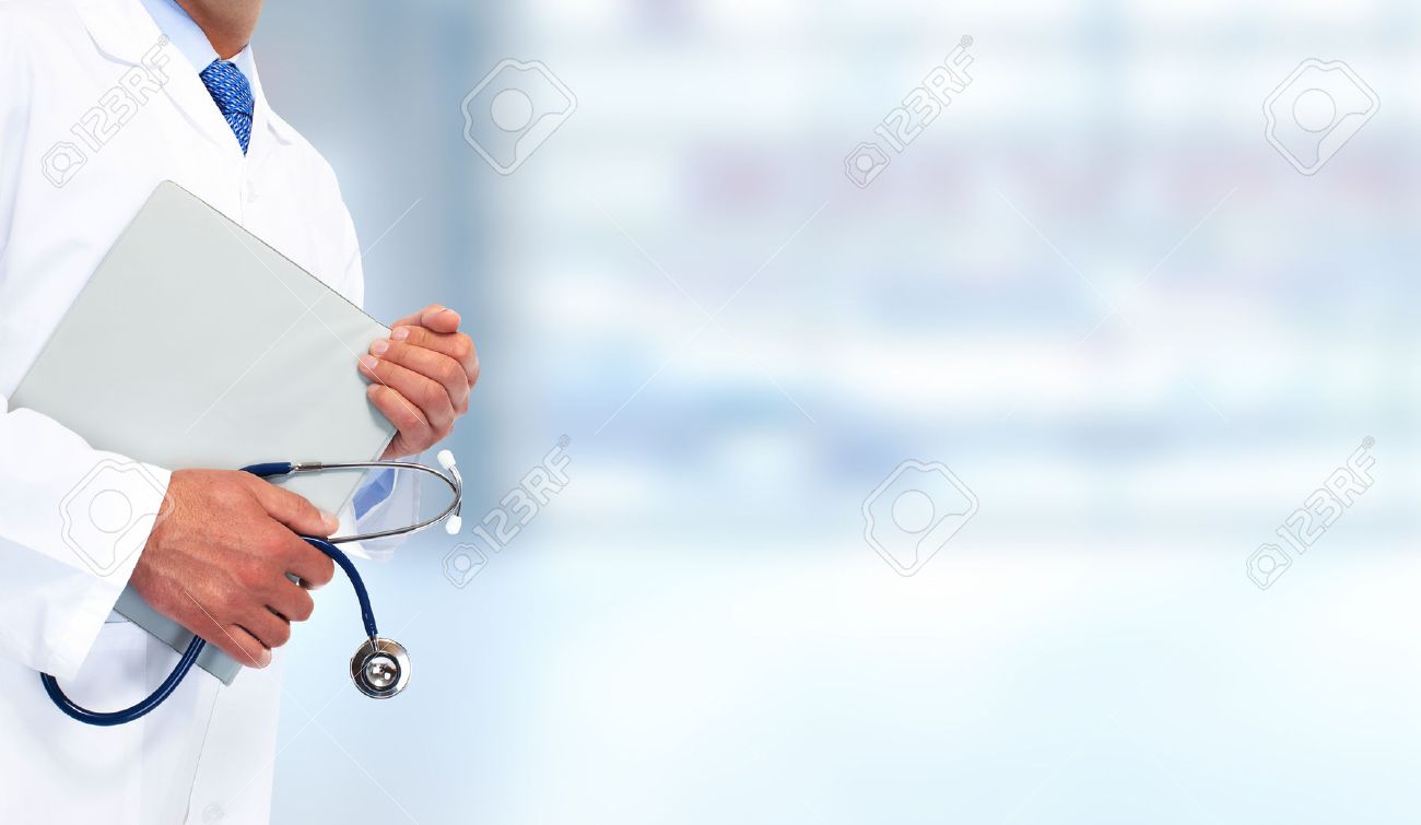 Hands Of Medical Doctor With Clipboard Health Care Background
