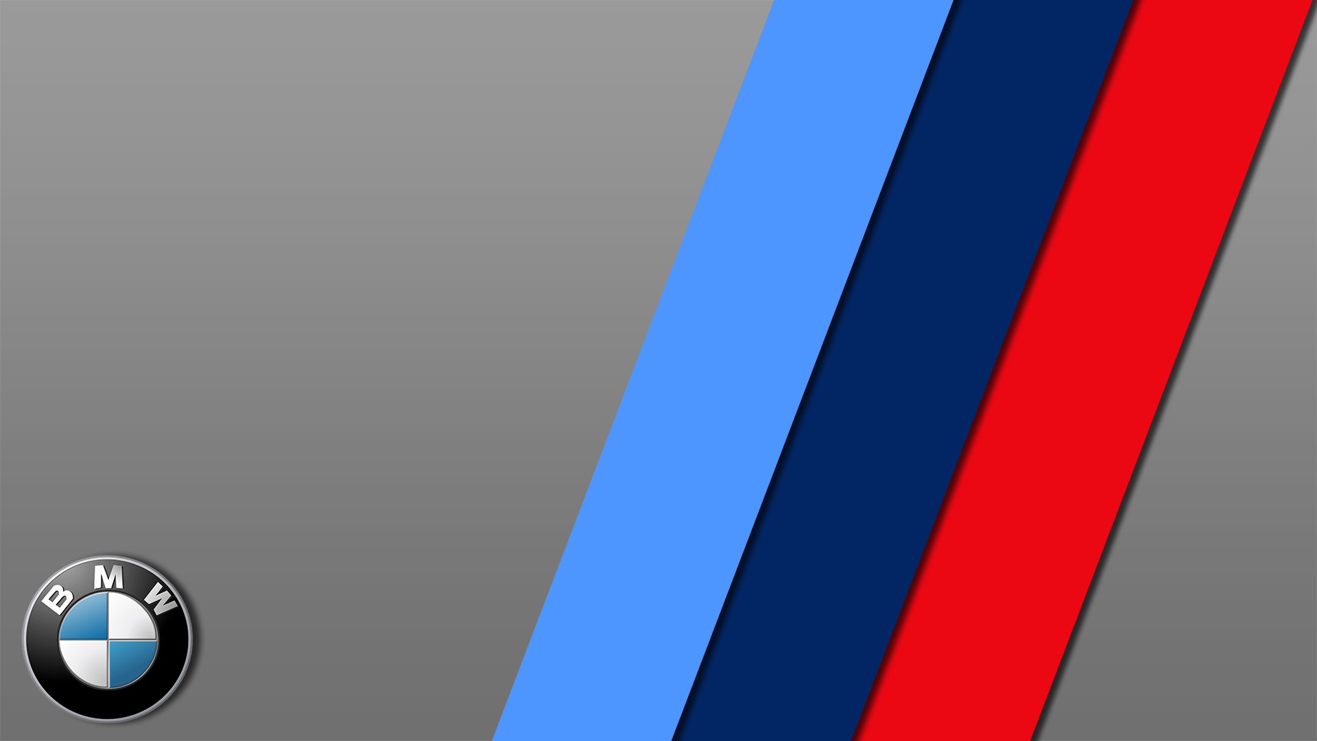 BMW M logo wallpaper with diagonal stripes in light blue, dark blue and red on a gray background