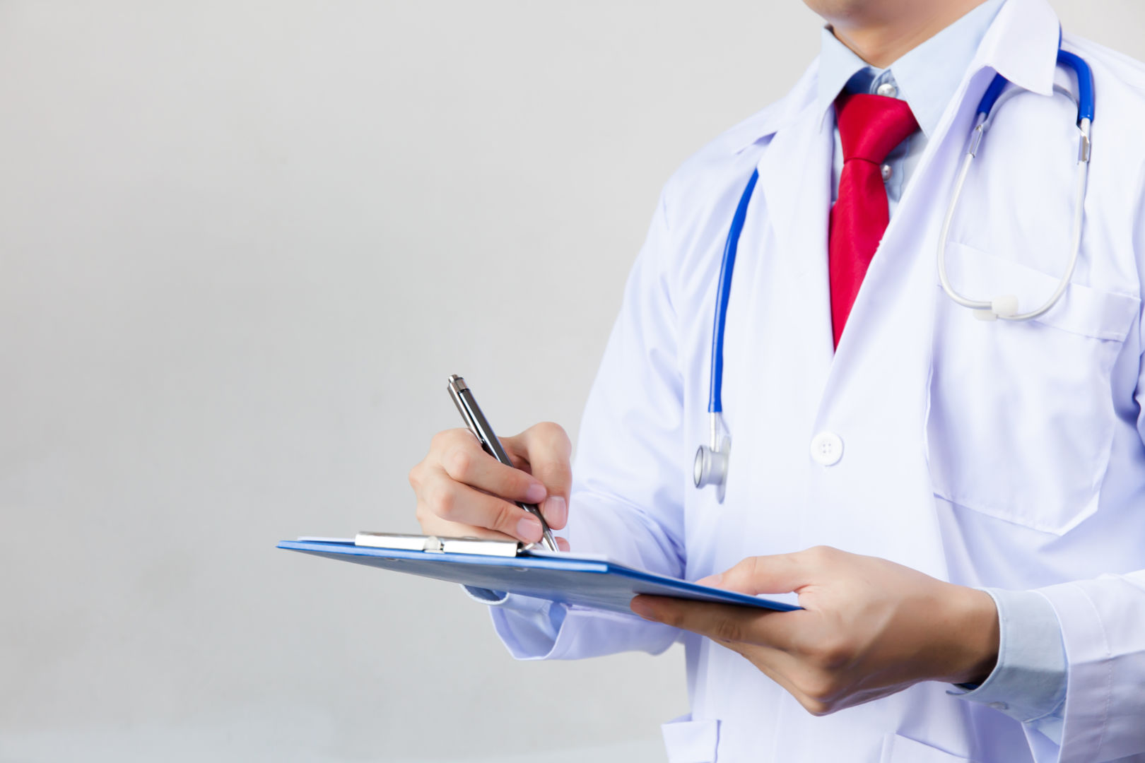 Medical Doctor Writing Prescription On White Isolated Background