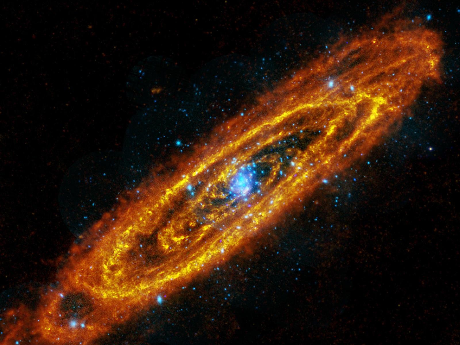 A stunning image of a spiral galaxy with fiery orange and blue hues, captured in the vast expanse of outer space