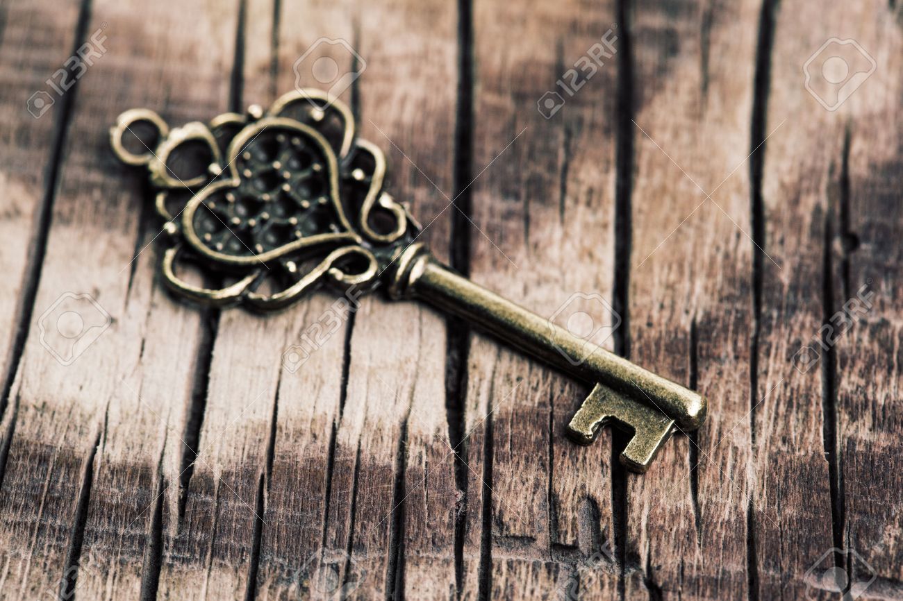 Vintage Key On Wooden Background Stock Photo Picture And Royalty